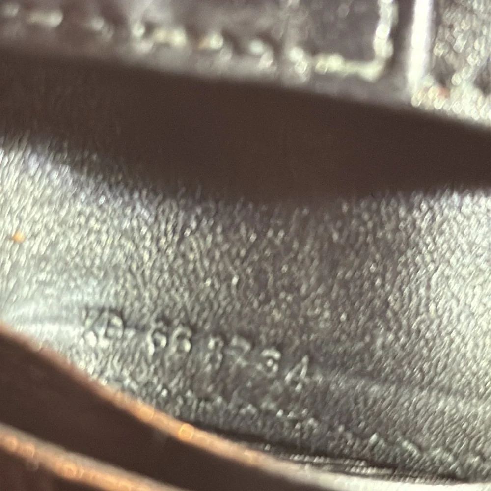 Salvador Ferragamo black bifold wallet.